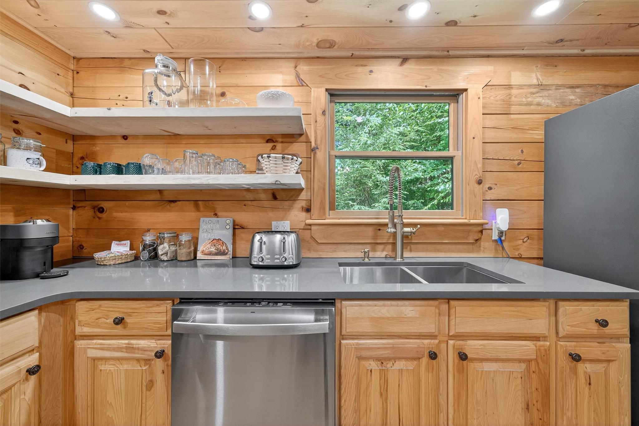 353 John Davis Road Beach Lake, PA 18405 - Photo 23 of 50 a kitchen with granite countertop a sink window and cabinets