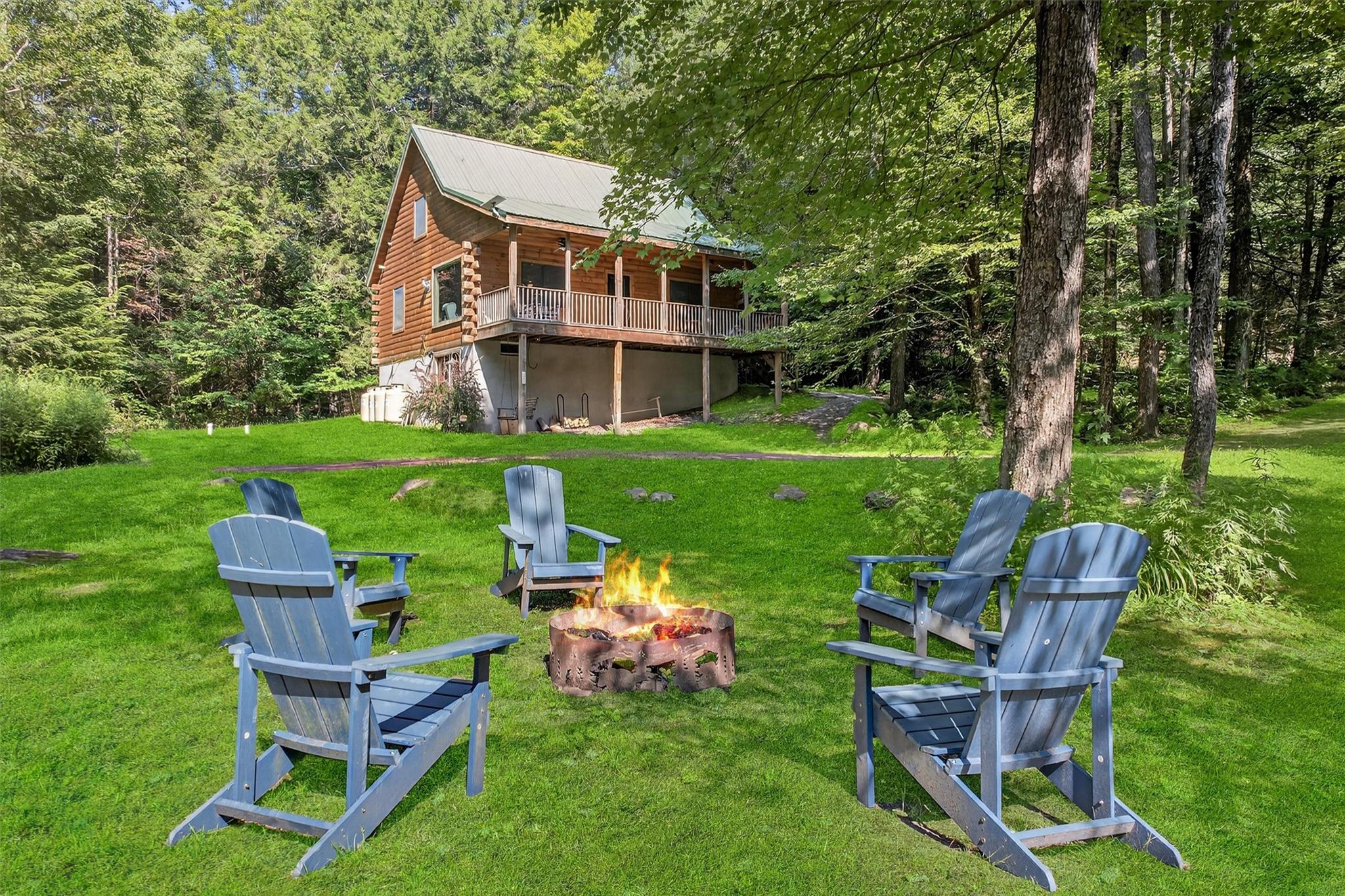 353 John Davis Road Beach Lake, PA 18405 - Photo 3 of 50 a view of a chair and table in the garden