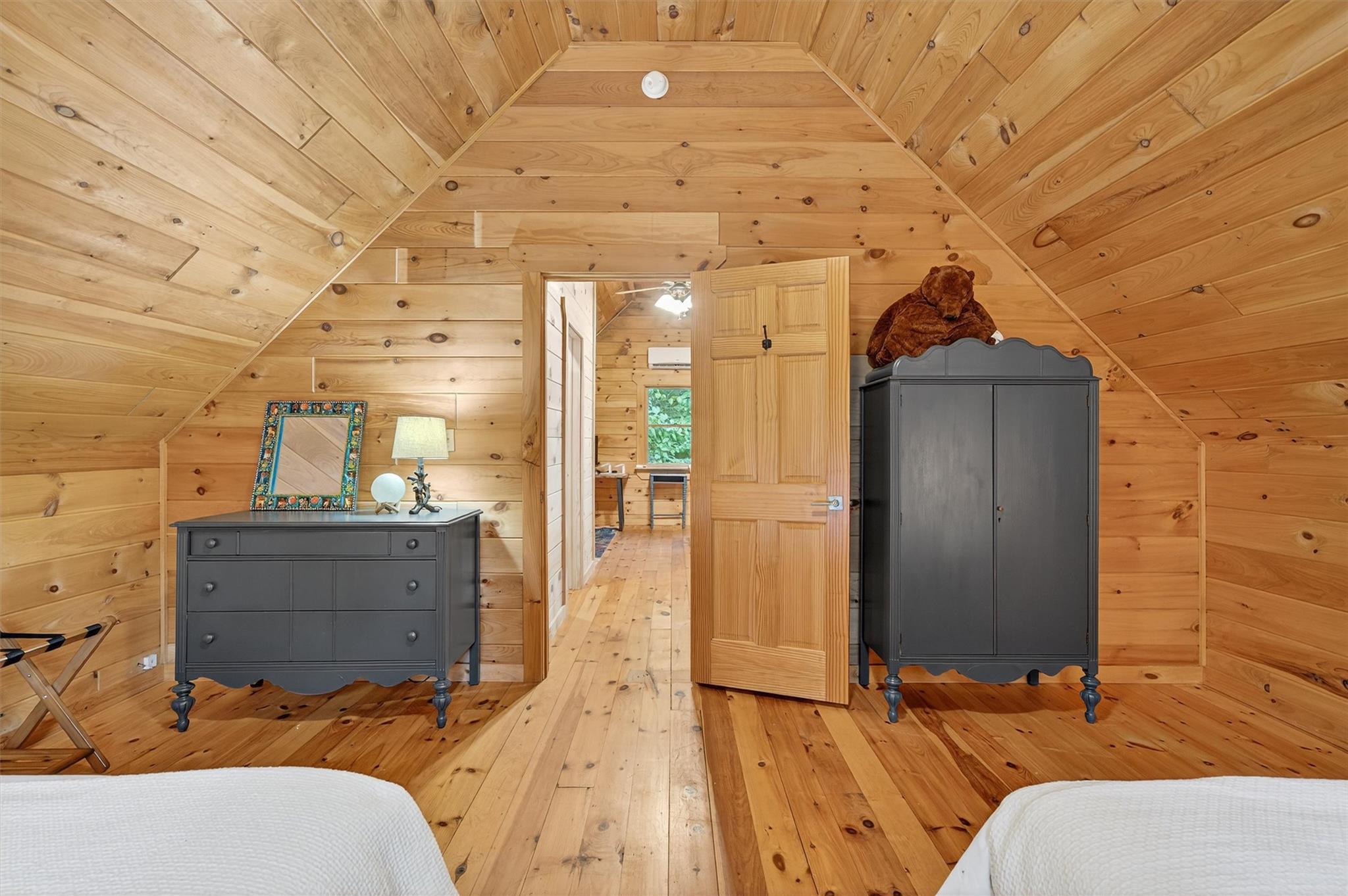 353 John Davis Road Beach Lake, PA 18405 - Photo 31 of 50 a bedroom with a bed and a mirror