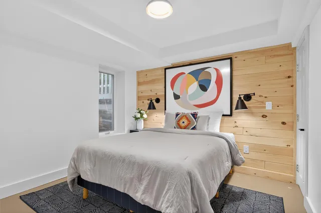 a kitchen with a sink cabinets and a wooden floor