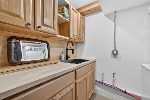 a bathroom with a shower and a window