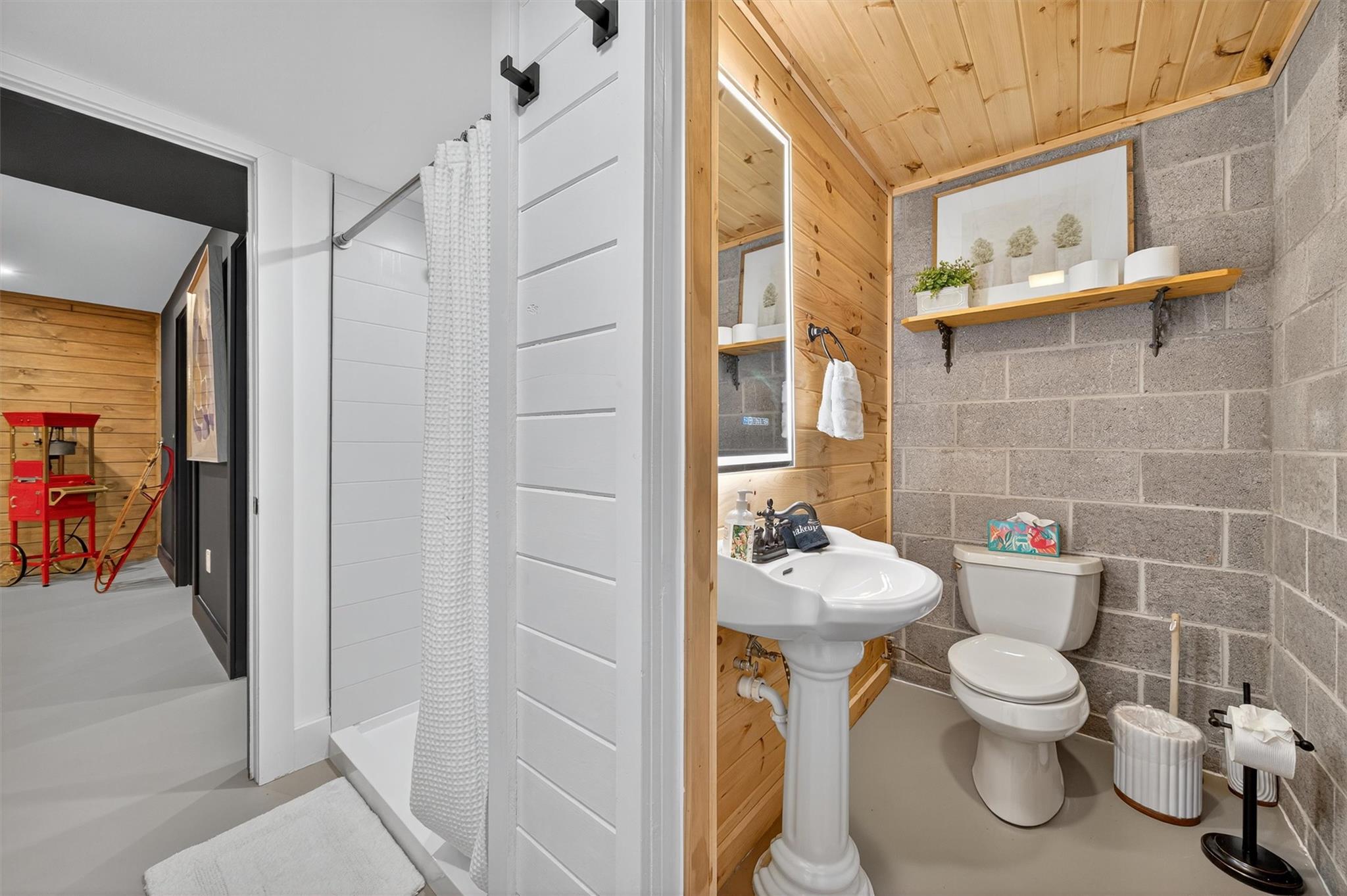 353 John Davis Road Beach Lake, PA 18405 - Photo 39 of 50 a bathroom with a toilet sink and shower