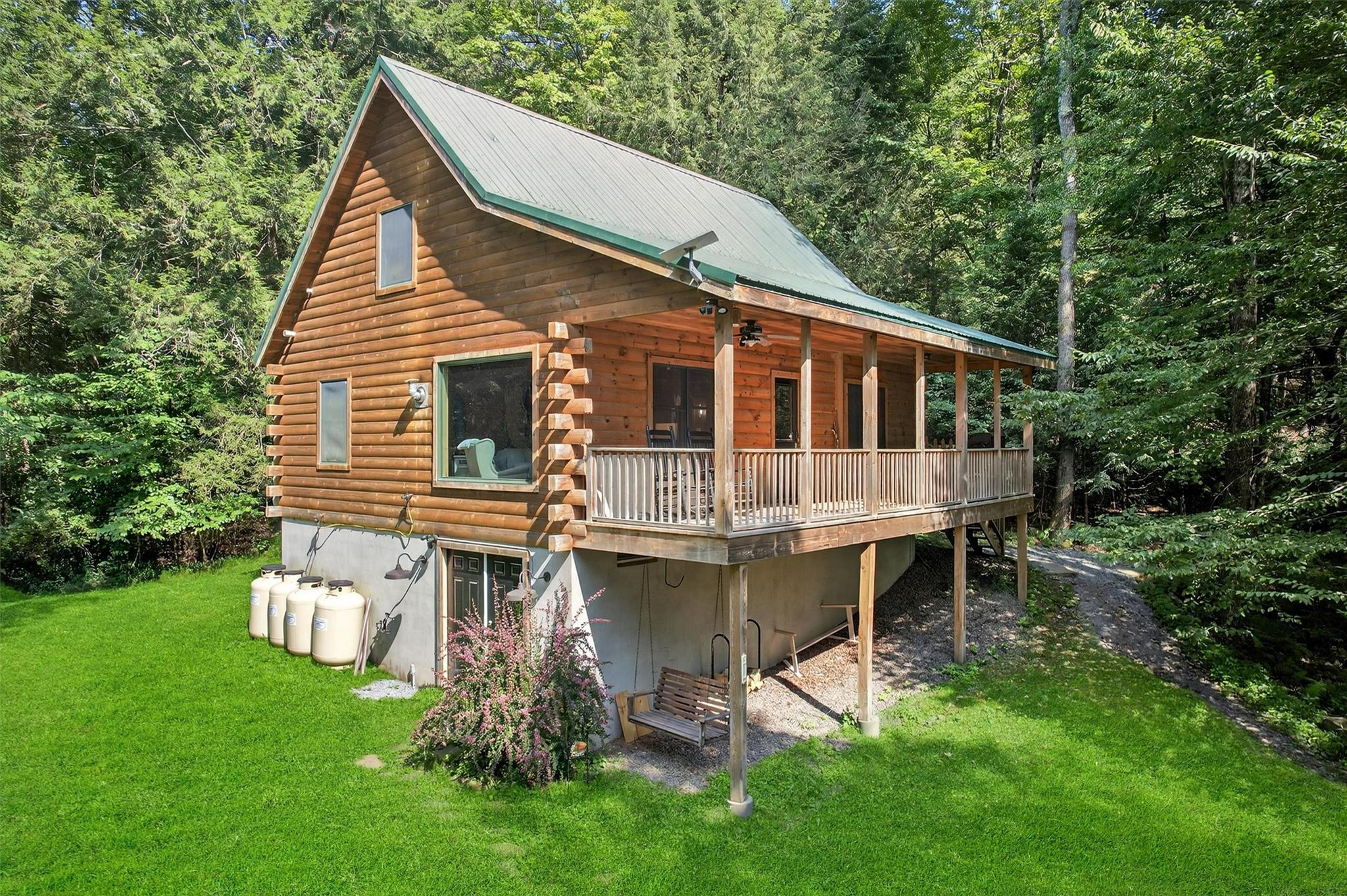 353 John Davis Road Beach Lake, PA 18405 - Photo 43 of 50 a view of a house with backyard and sitting area