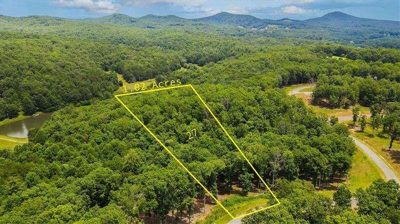 0 Ridge Drive Morganton, GA 30560 - Photo 1 of 15 a view of a lush green forest with a house in the background