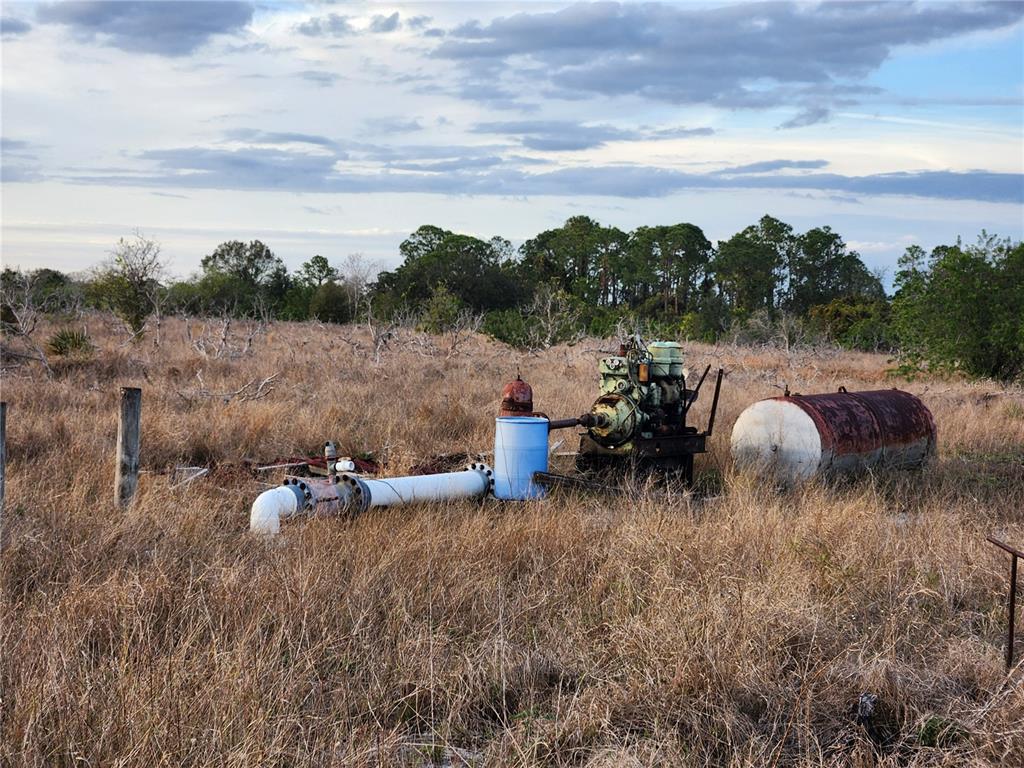 West Frostproof Road Frostproof, FL 33843 - Photo 11 of 29 a view of a golf course with lawn chairs and a fire pit