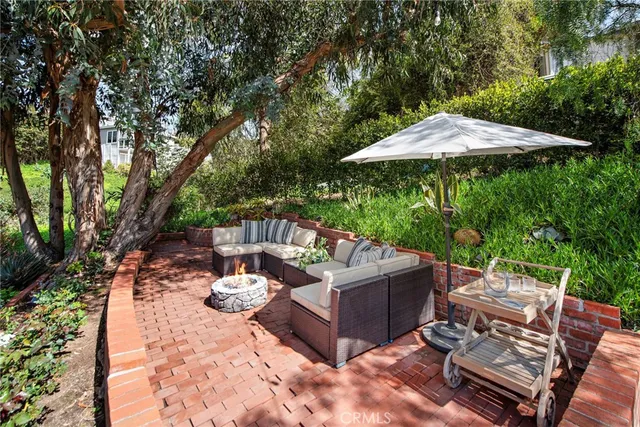 a view of a patio with furniture and a table