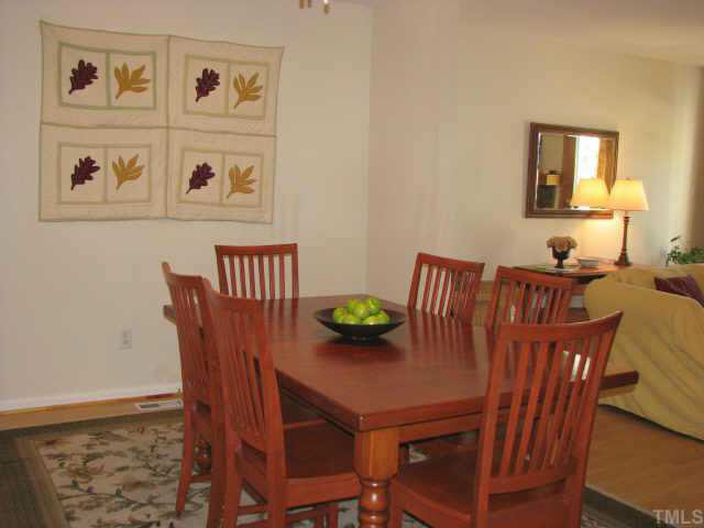 5711 Pool Side Drive Raleigh, NC 27612 - Photo 3 of 10 Spacious dining room with beautiful laminate flooring-overlooks the great room and the kitchen Other
