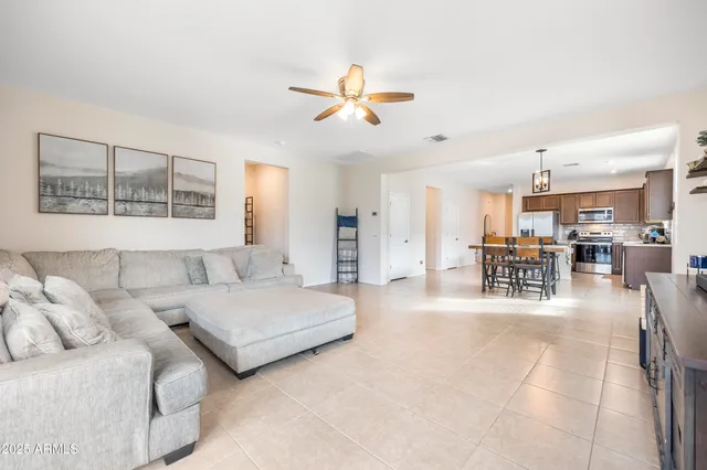 a living room with couches and flat screen tv