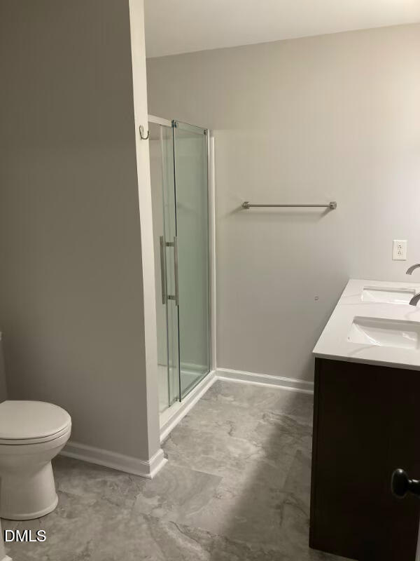 1505 Woodland Road Garner, NC 27529 - Photo 15 of 19 a bathroom with a sink a toilet and shower