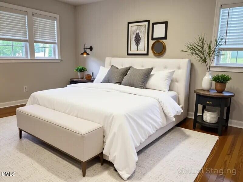 1505 Woodland Road Garner, NC 27529 - Photo 7 of 19 a bedroom with a bed and window