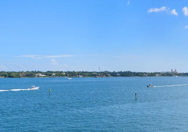 a view of an ocean beach and mountain