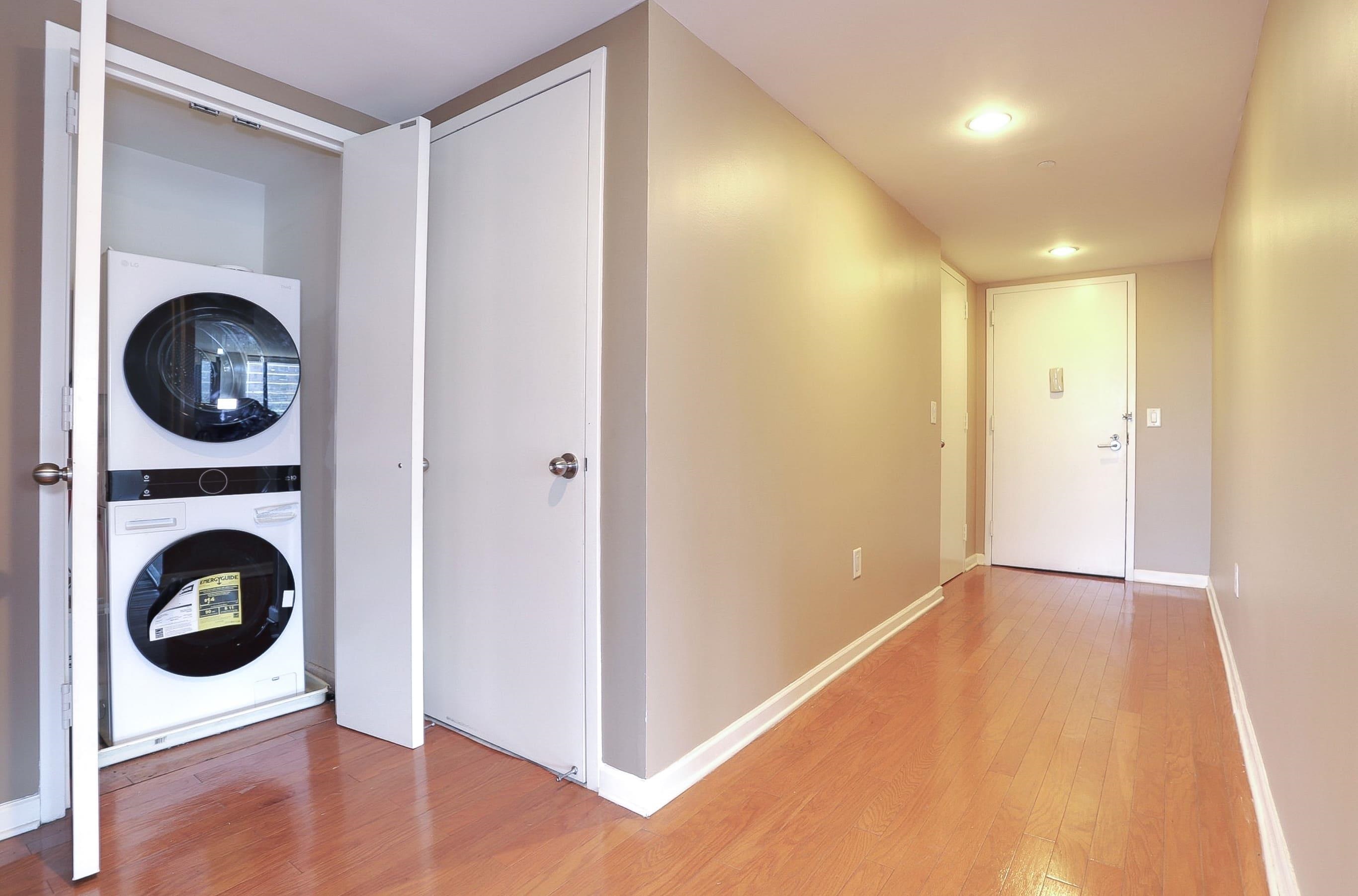 700 Grove Street, Unit 4F Jersey City, NJ 07310 - Photo 12 of 30 a view of a hallway with washer and dryer