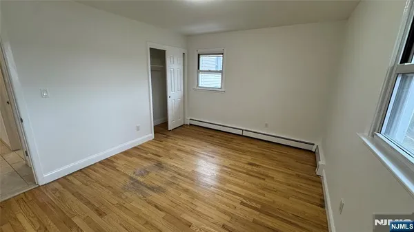 a front view of a house with a garden and deck