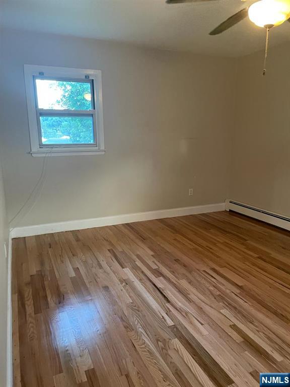 28 Boyd Street Lodi, NJ 07644 - Photo 5 of 7 a view of a room with wooden floor and window