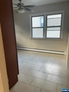 a bathroom with a window and a shower