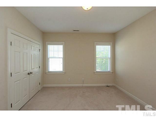 4701 All Points View Way Raleigh, NC 27614 - Photo 14 of 20 Spacious secondary bedroom with large closet and neutral decor.