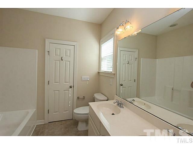 4701 All Points View Way Raleigh, NC 27614 - Photo 15 of 20 This bathroom features a large double vanity and tub/shower