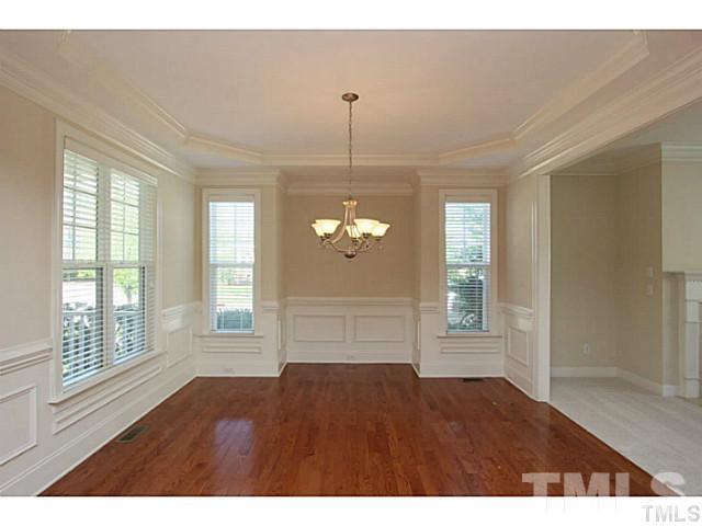 4701 All Points View Way Raleigh, NC 27614 - Photo 5 of 20 Formal dining room with wainscoting, detailed moldings, trey ceiling, hardwood flooring, multiple windows provide plenty of natural light. Opens to family room...perfect when entertaining family & friends.