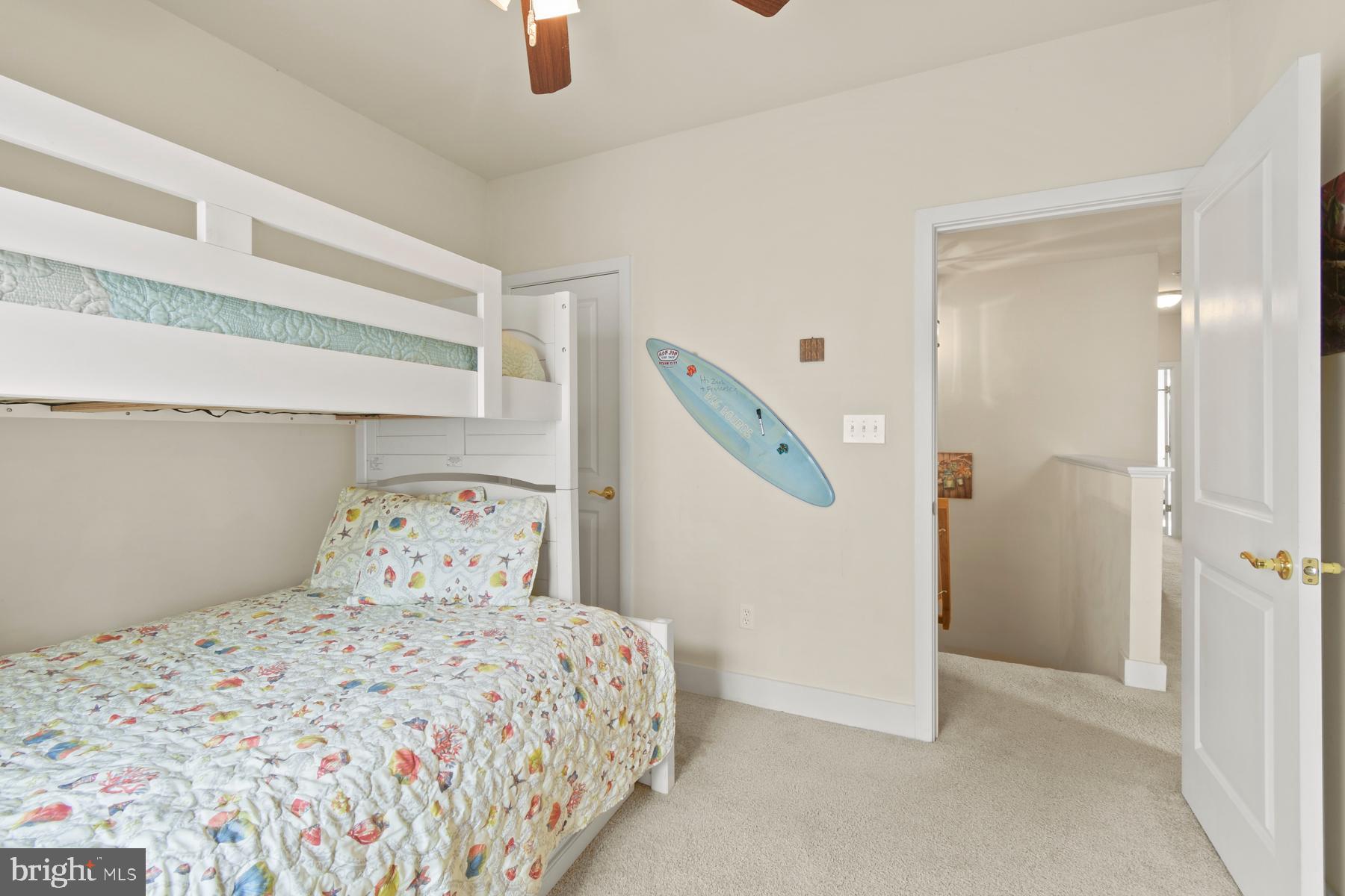 107 70th Street, Unit 10F Ocean City, MD 21842 - Photo 17 of 33 a bedroom with a bed and a window
