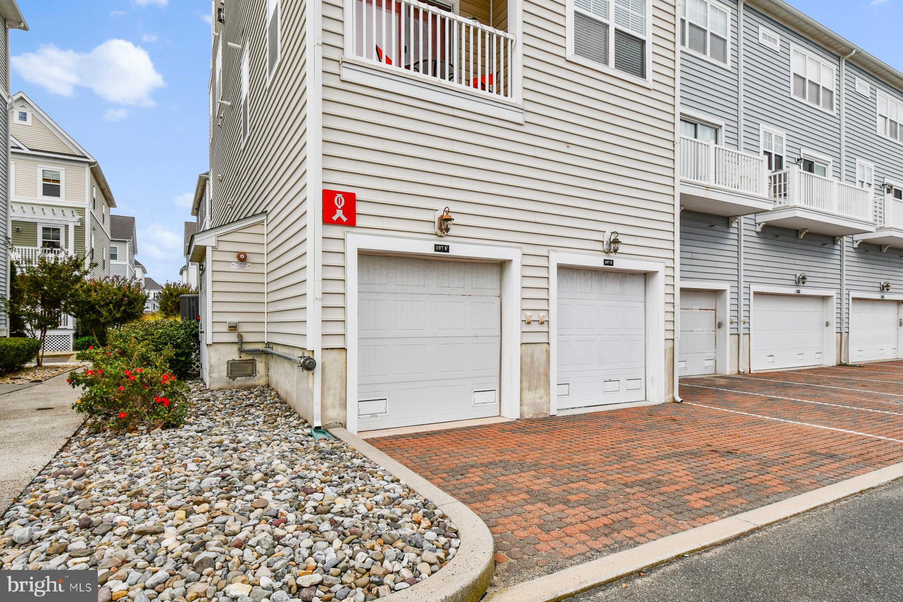 107 70th Street, Unit 10F Ocean City, MD 21842 - Photo 24 of 33 a view of a house with a backyard