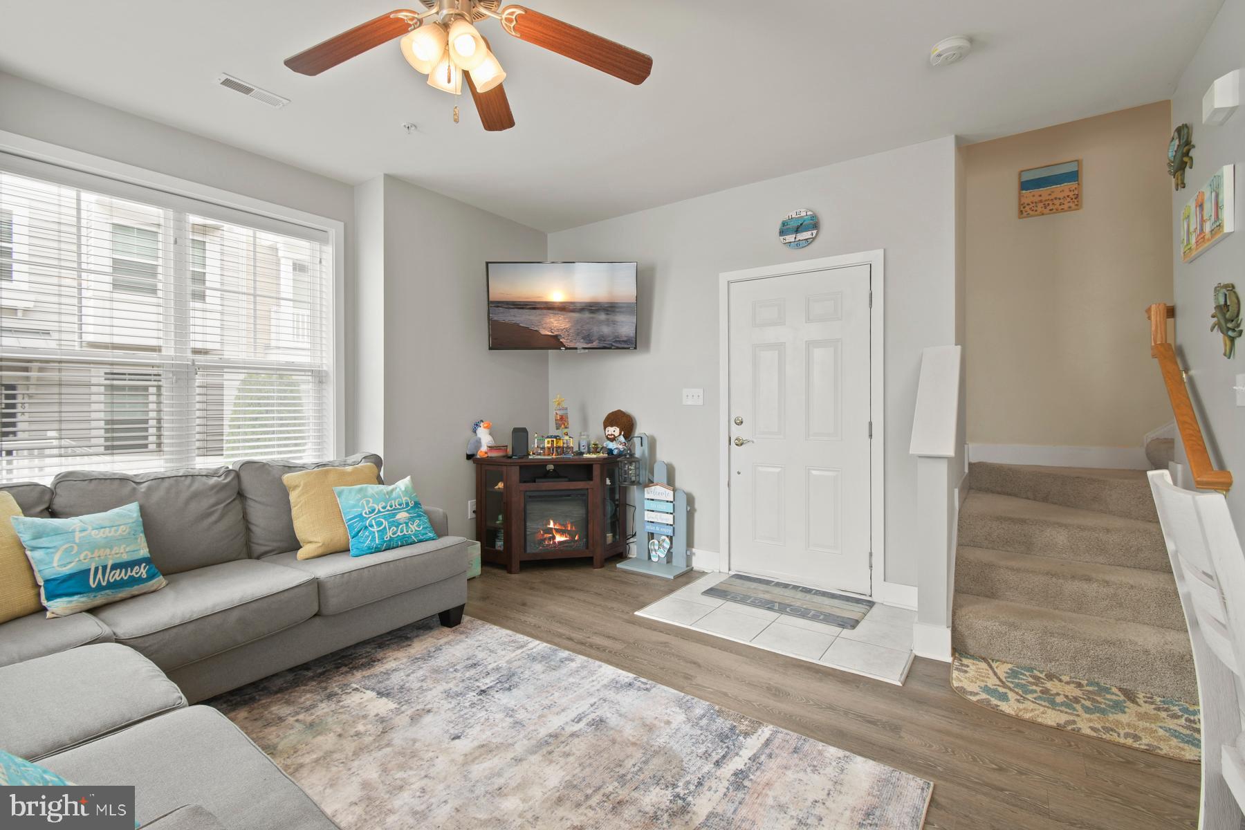 107 70th Street, Unit 10F Ocean City, MD 21842 - Photo 3 of 33 a living room with furniture and a flat screen tv