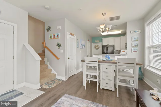 a view of dining room with furniture and wooden floor