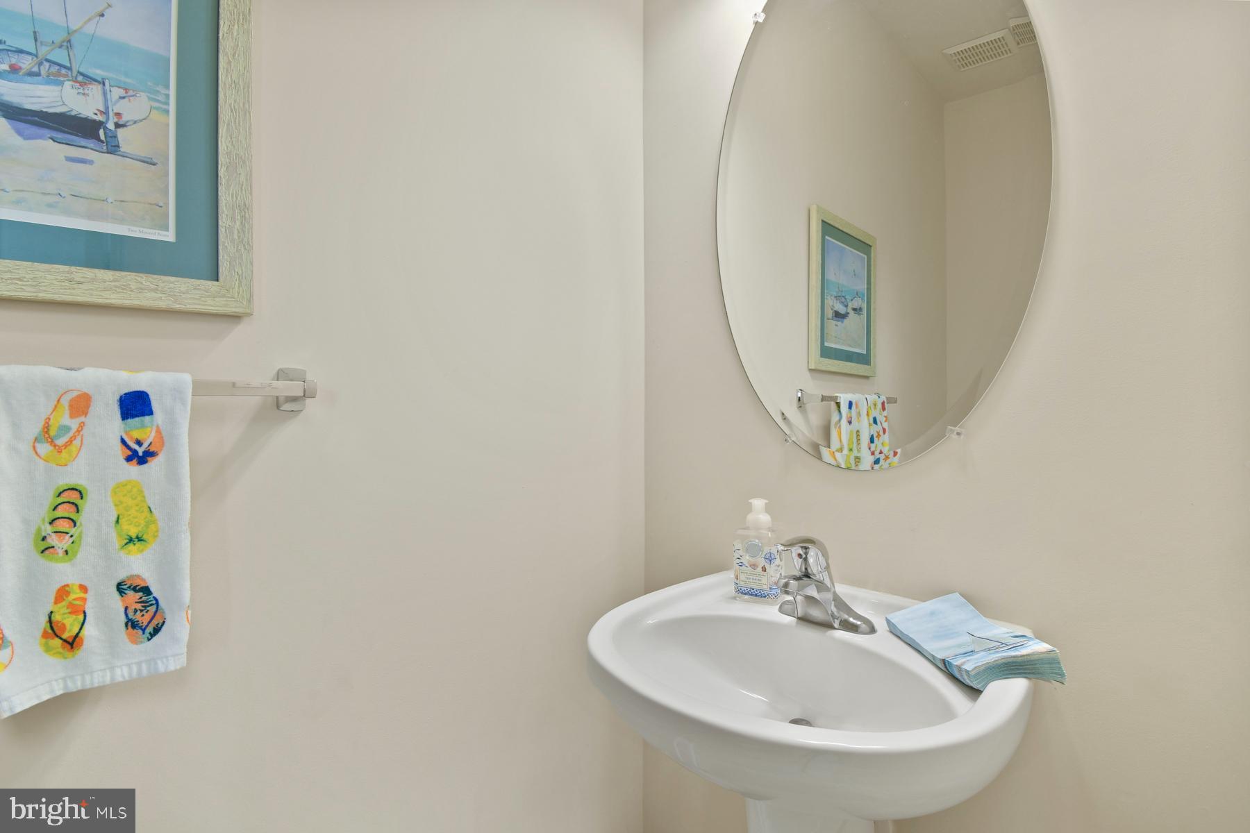 107 70th Street, Unit 10F Ocean City, MD 21842 - Photo 9 of 33 a bathroom with a sink and a mirror