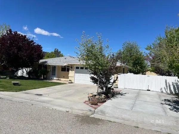 a bathroom with a toilet and a shower curtain