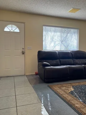 a view of a house with a tub and a yard
