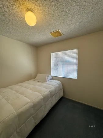 a bathroom with a toilet and a shower curtain