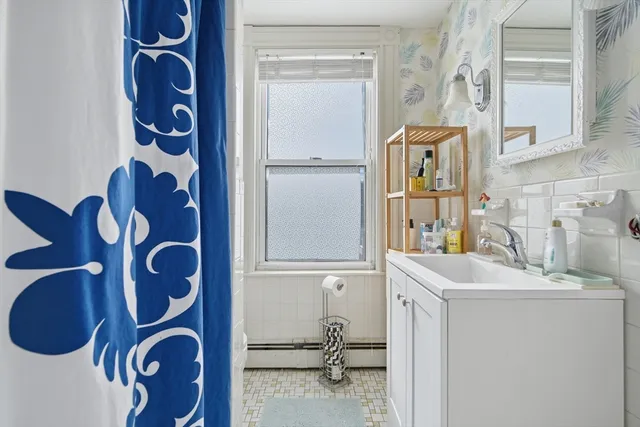 a bathroom with a bathtub and shower