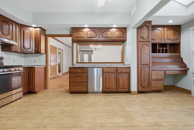 a kitchen with stainless steel appliances a stove and a refrigerator