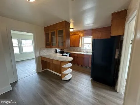 a kitchen with a refrigerator and a sink