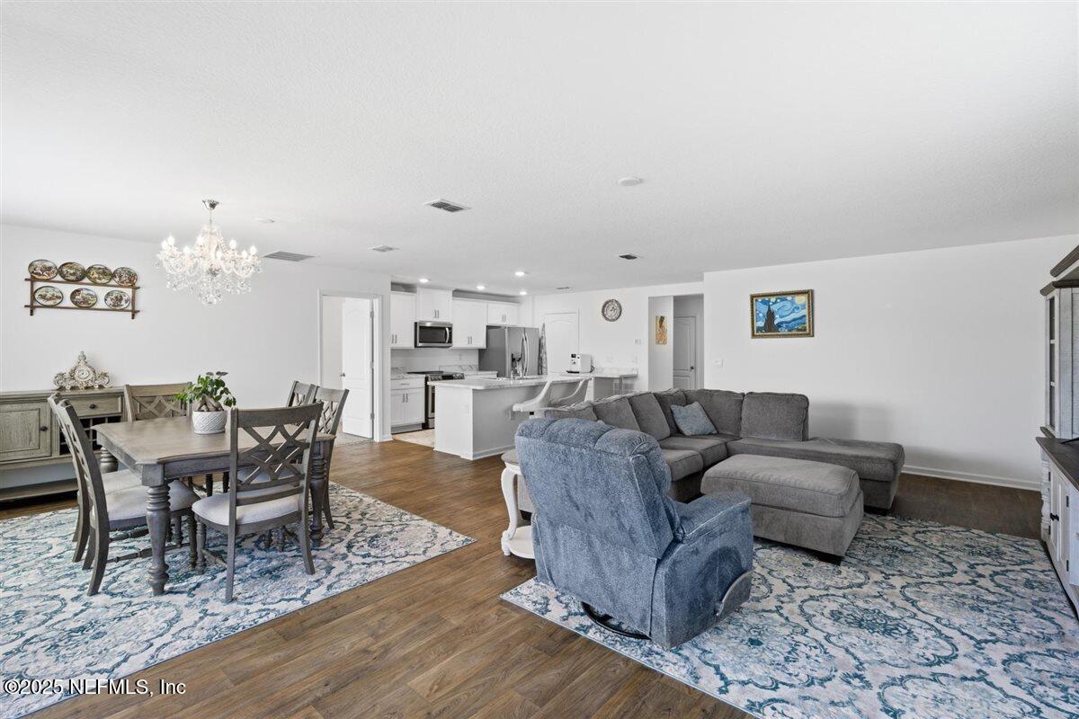 137 Tordera Ln Street St. Augustine, FL 32084 - Photo 17 of 43 a living room with furniture and a dining table