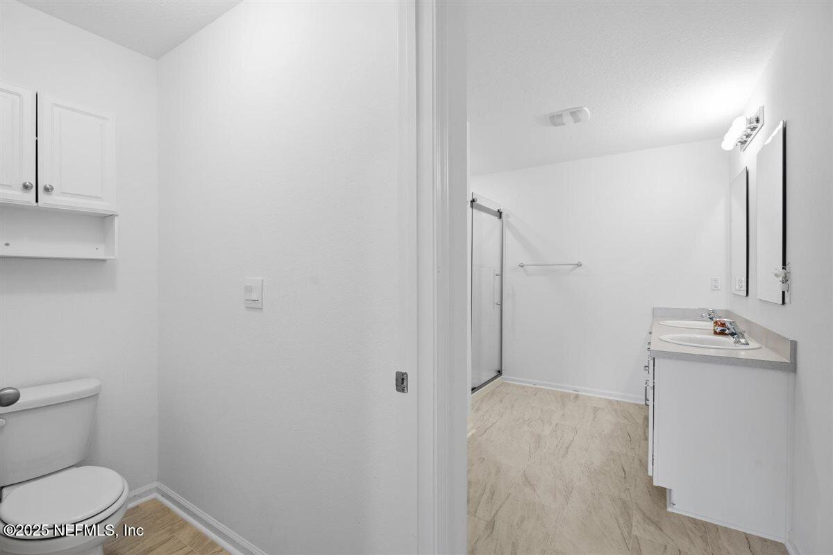 137 Tordera Ln Street St. Augustine, FL 32084 - Photo 23 of 43 a bathroom with a sink toilet and shower