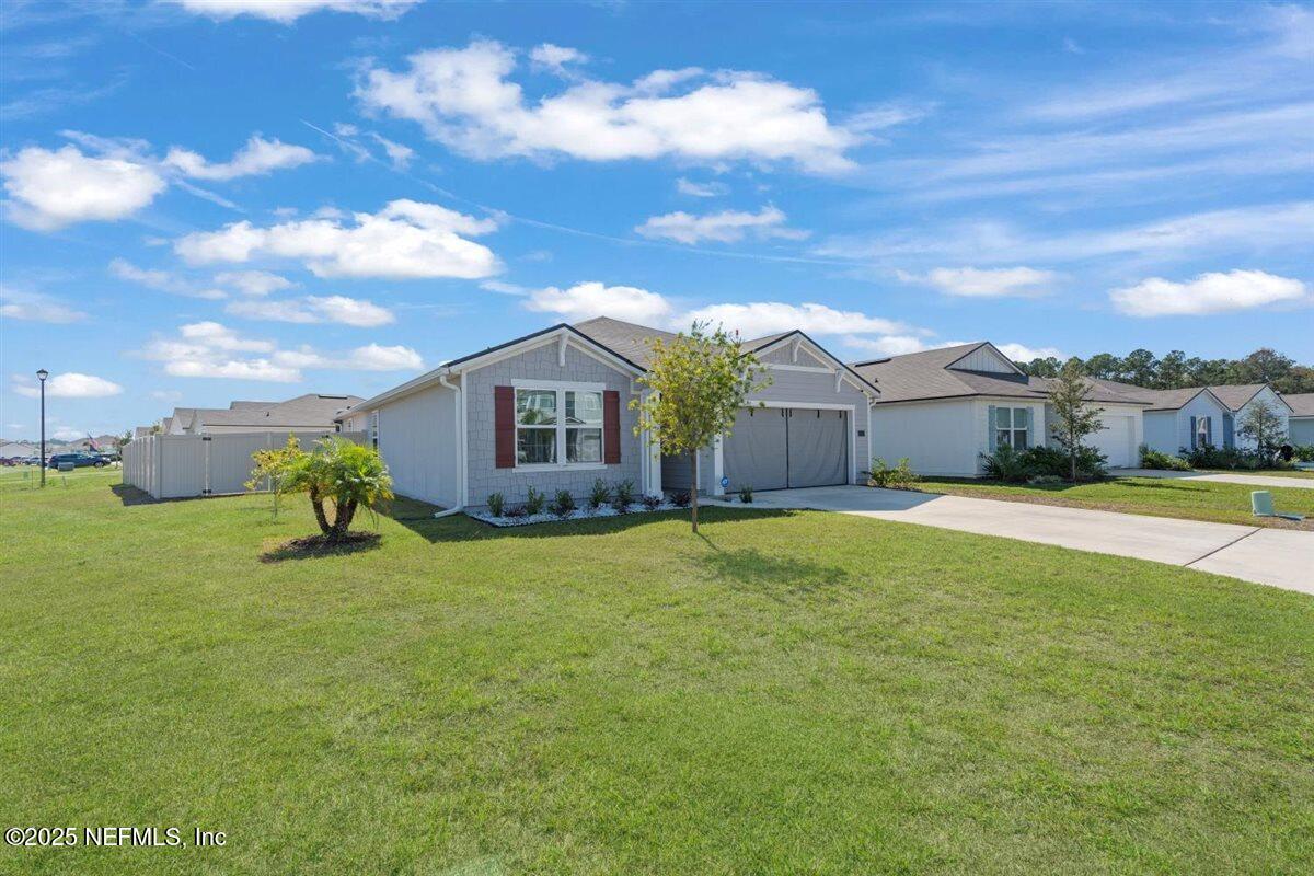 137 Tordera Ln Street St. Augustine, FL 32084 - Photo 26 of 43 a view of a house with a yard