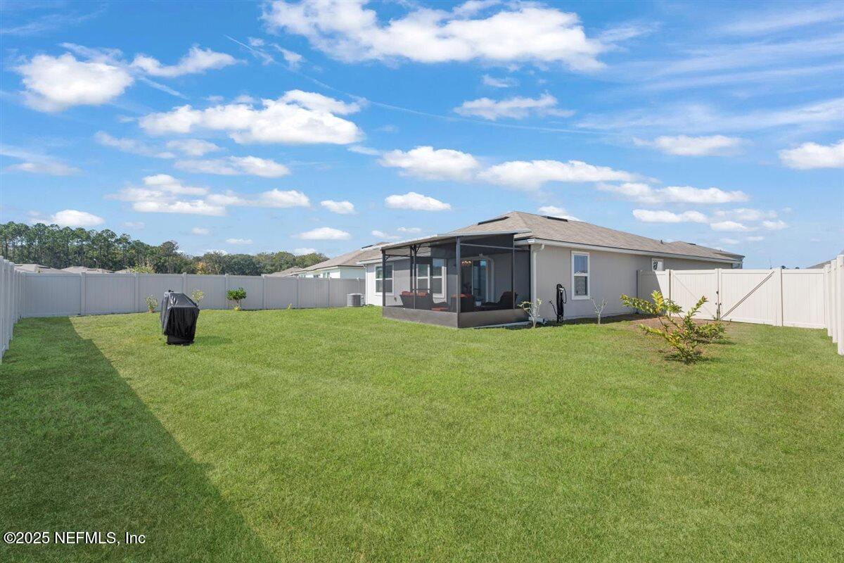 137 Tordera Ln Street St. Augustine, FL 32084 - Photo 28 of 43 a view of a house with a backyard