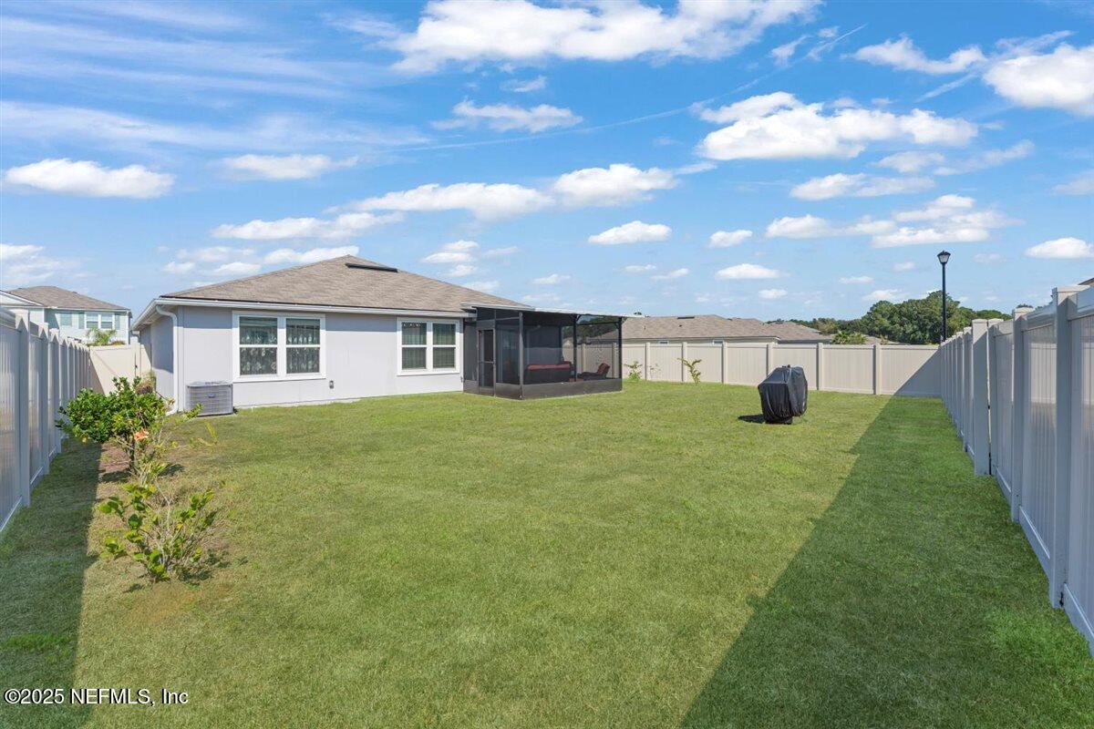 137 Tordera Ln Street St. Augustine, FL 32084 - Photo 29 of 43 a front view of a house with a yard