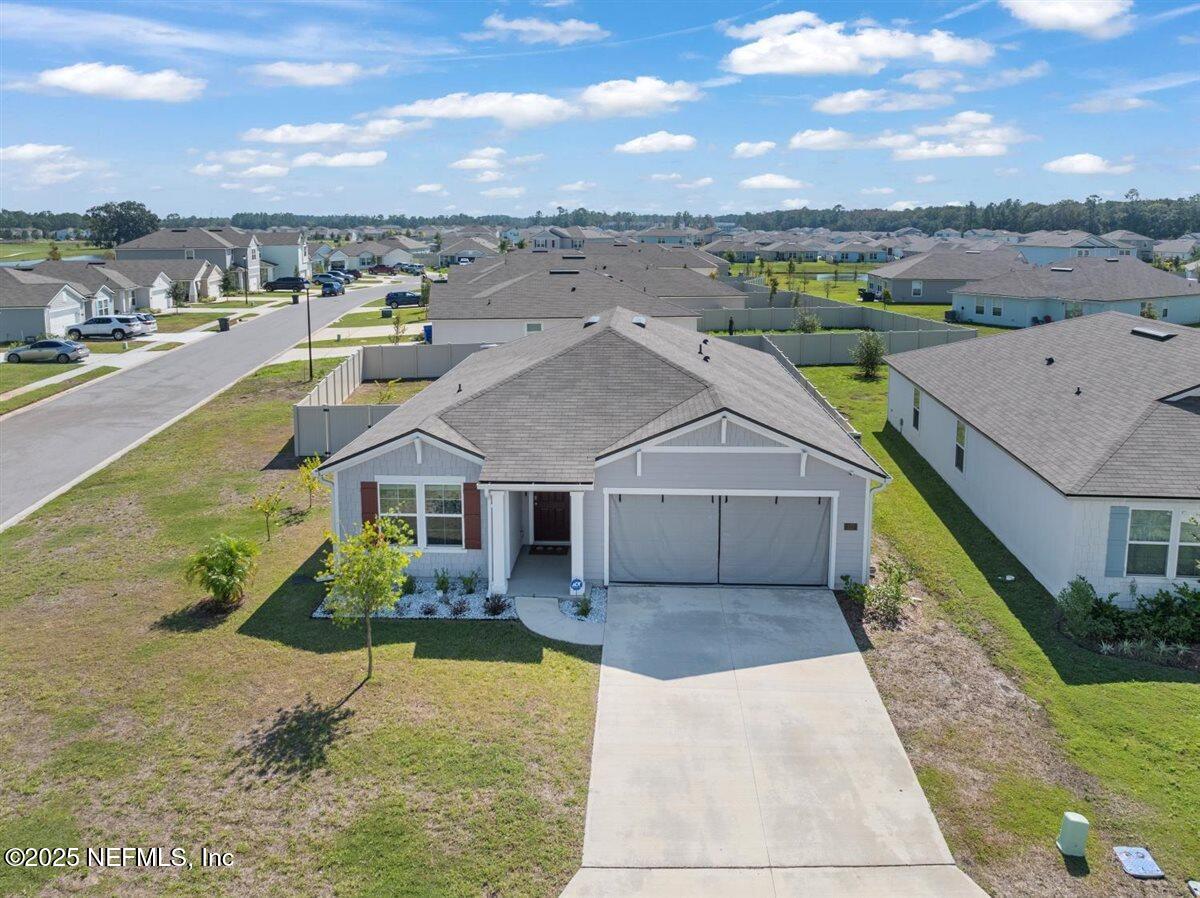 137 Tordera Ln Street St. Augustine, FL 32084 - Photo 30 of 43 an aerial view of a house with a big yard