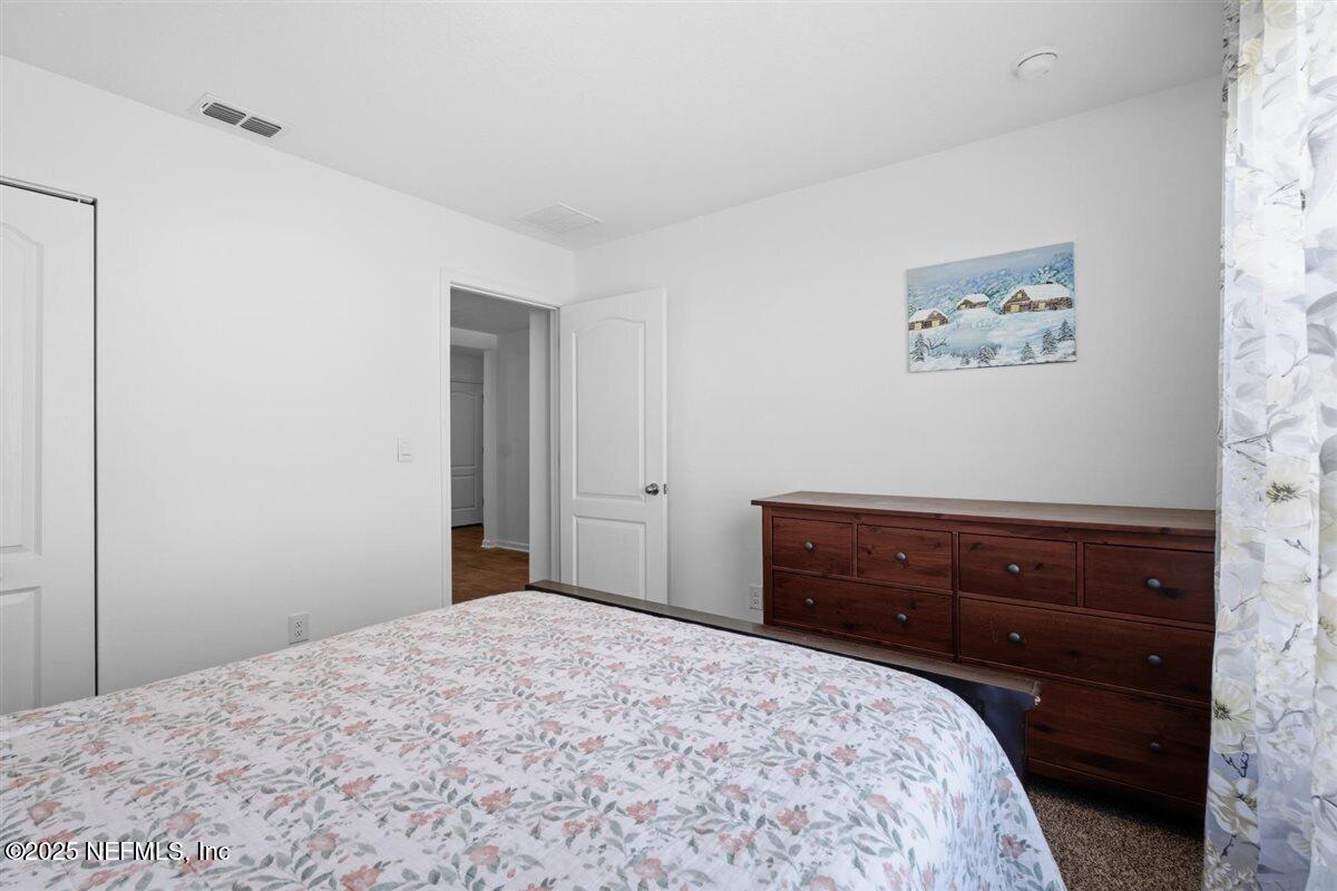 137 Tordera Ln Street St. Augustine, FL 32084 - Photo 6 of 43 a bedroom with a bed and a window