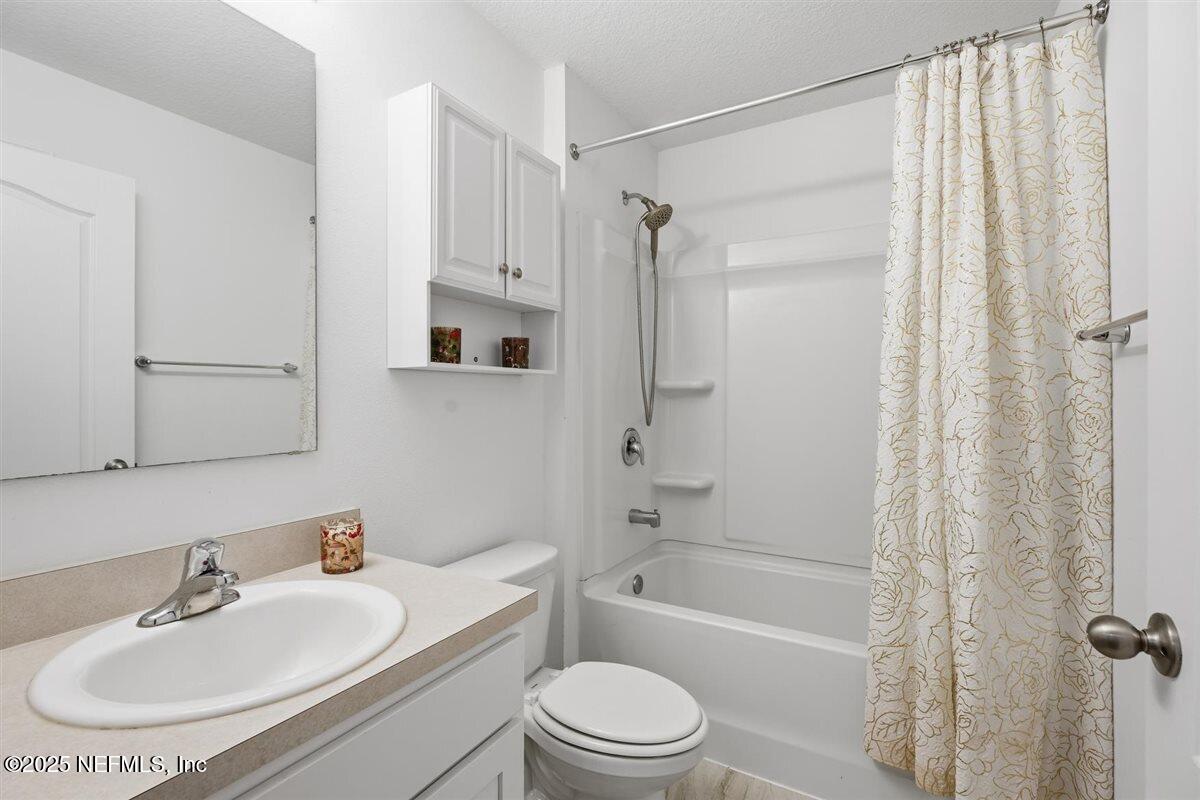 137 Tordera Ln Street St. Augustine, FL 32084 - Photo 7 of 43 a bathroom with a sink toilet and shower