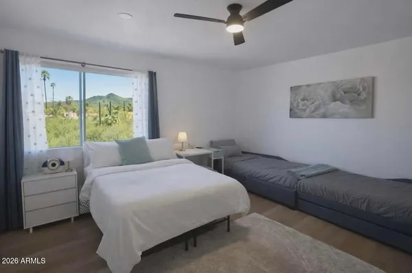 a bedroom with a bed and a couch