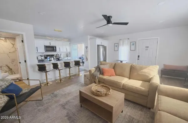 a living room with furniture and a large window