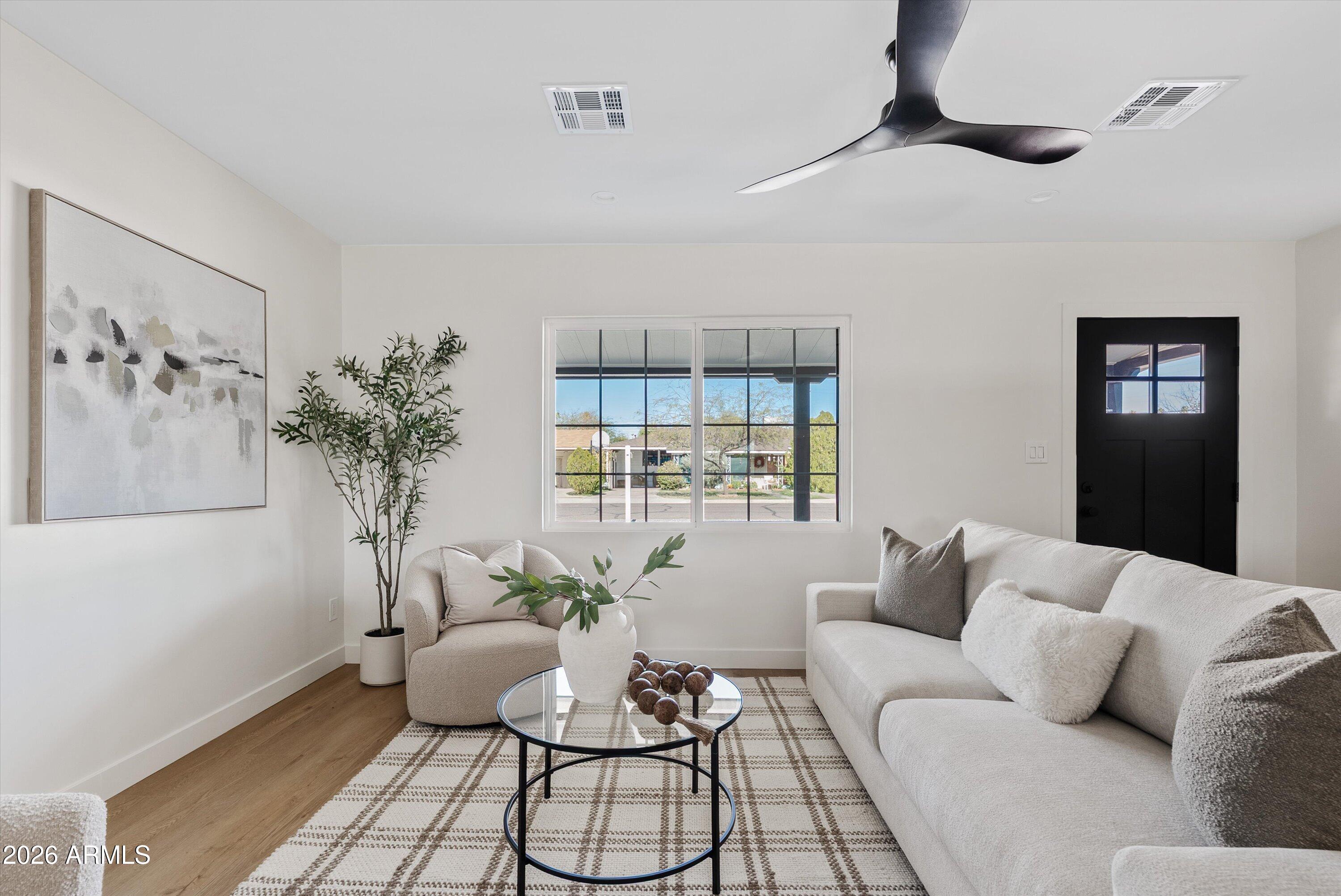 2941 East Cheery Lynn Road Phoenix, AZ 85016 - Photo 11 of 25 a living room with furniture and a potted plant