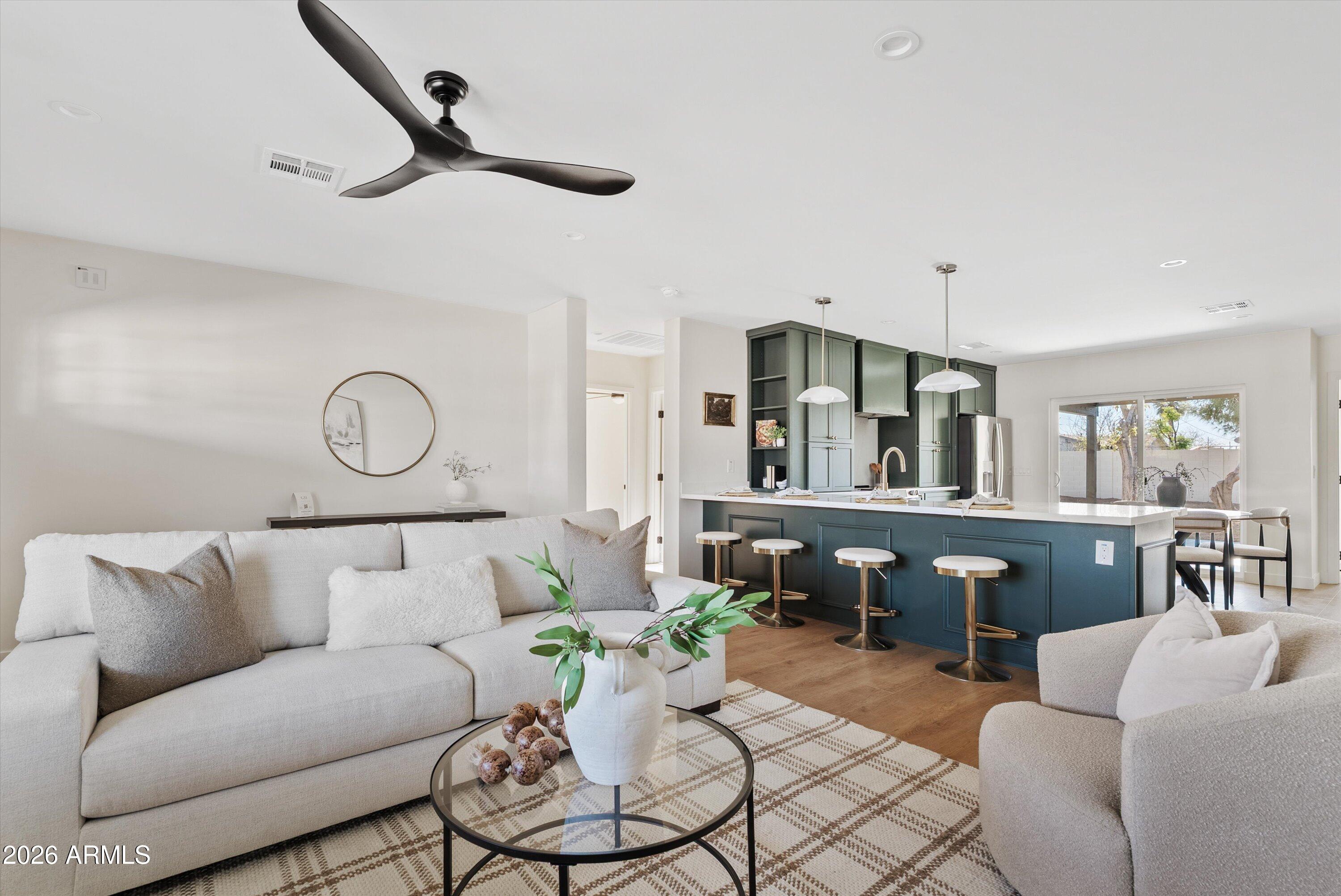 2941 East Cheery Lynn Road Phoenix, AZ 85016 - Photo 12 of 25 a living room with furniture kitchen view and a window