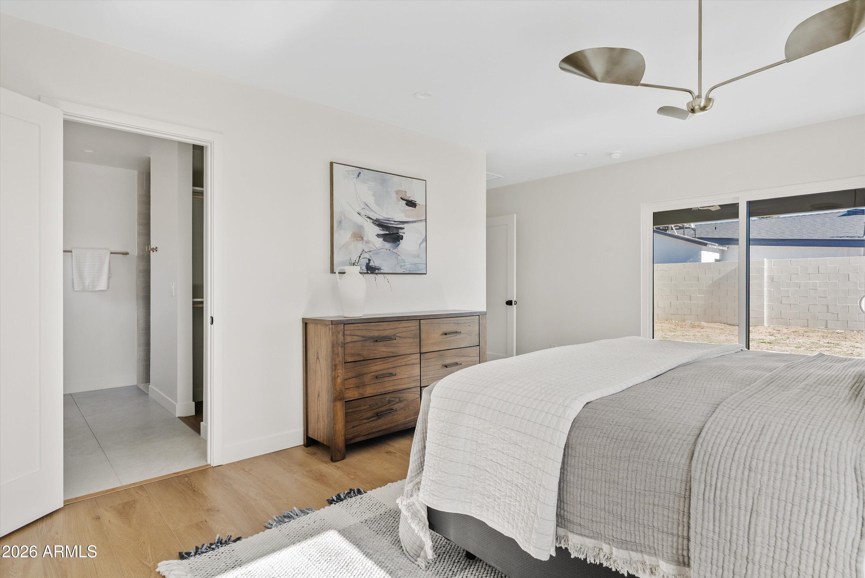 2941 East Cheery Lynn Road Phoenix, AZ 85016 - Photo 19 of 25 a bedroom with a bed and a painting on the wall