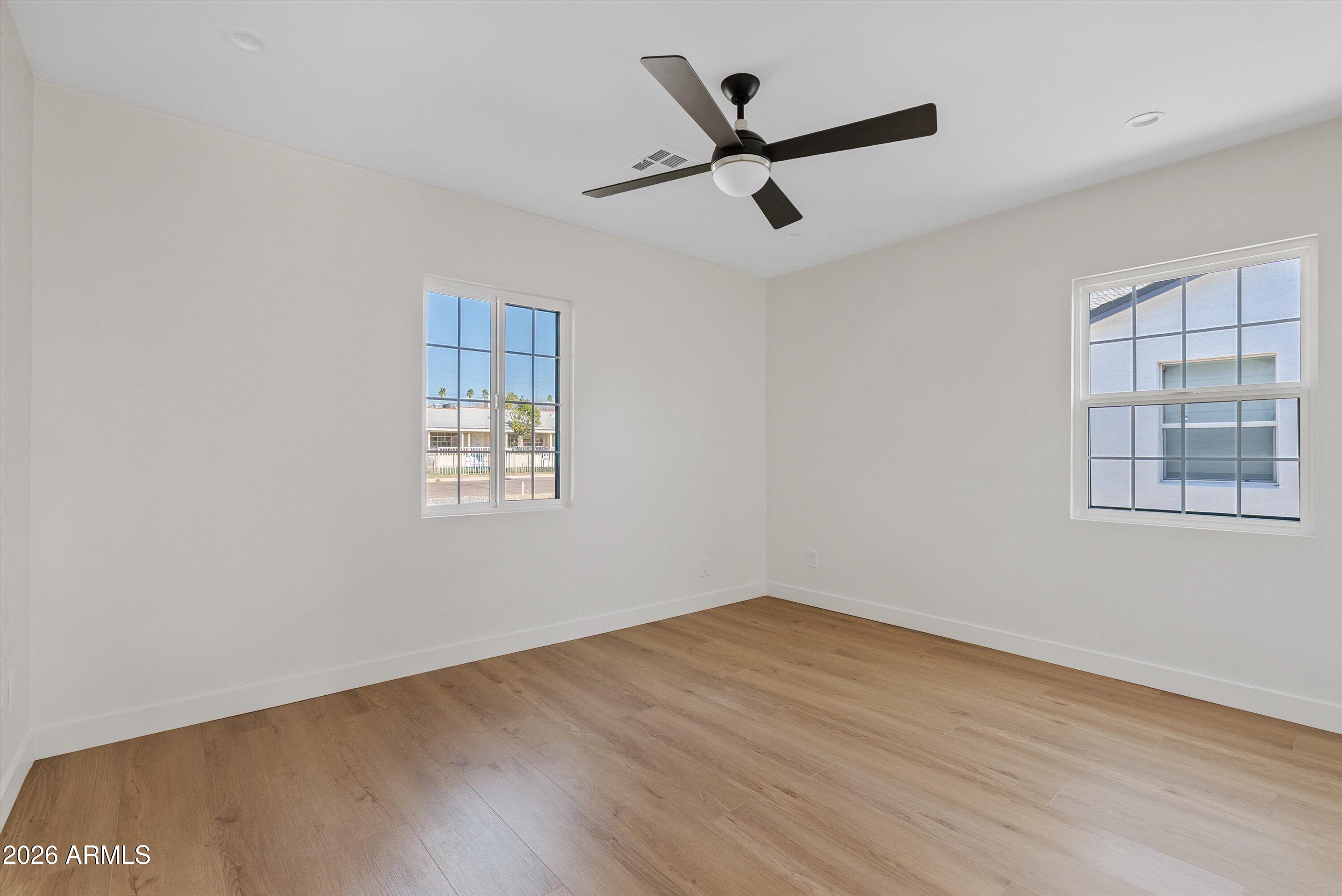 2941 East Cheery Lynn Road Phoenix, AZ 85016 - Photo 21 of 25 wooden floor in an empty room with a window