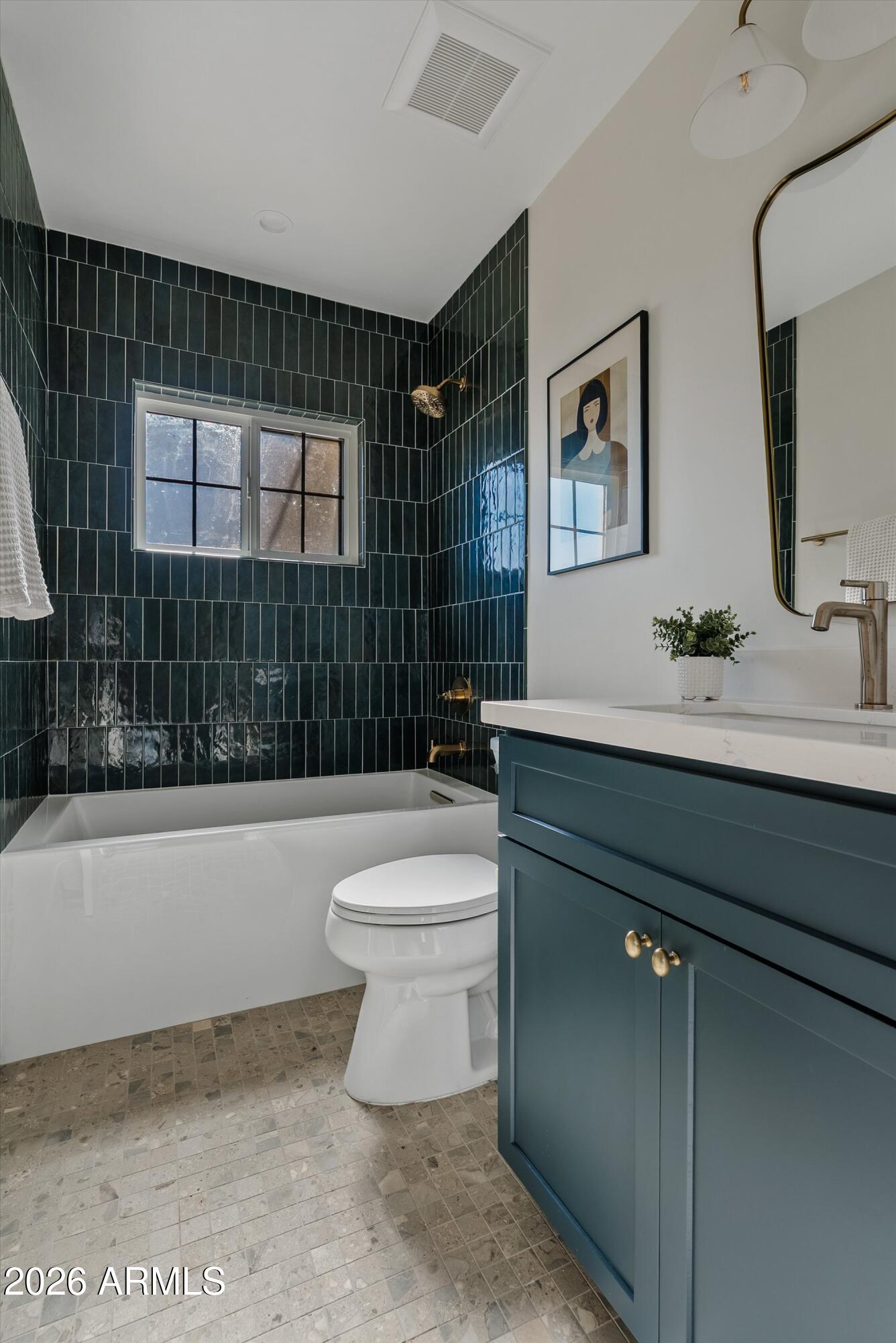 2941 East Cheery Lynn Road Phoenix, AZ 85016 - Photo 4 of 25 a bathroom with a sink a toilet and bathtub