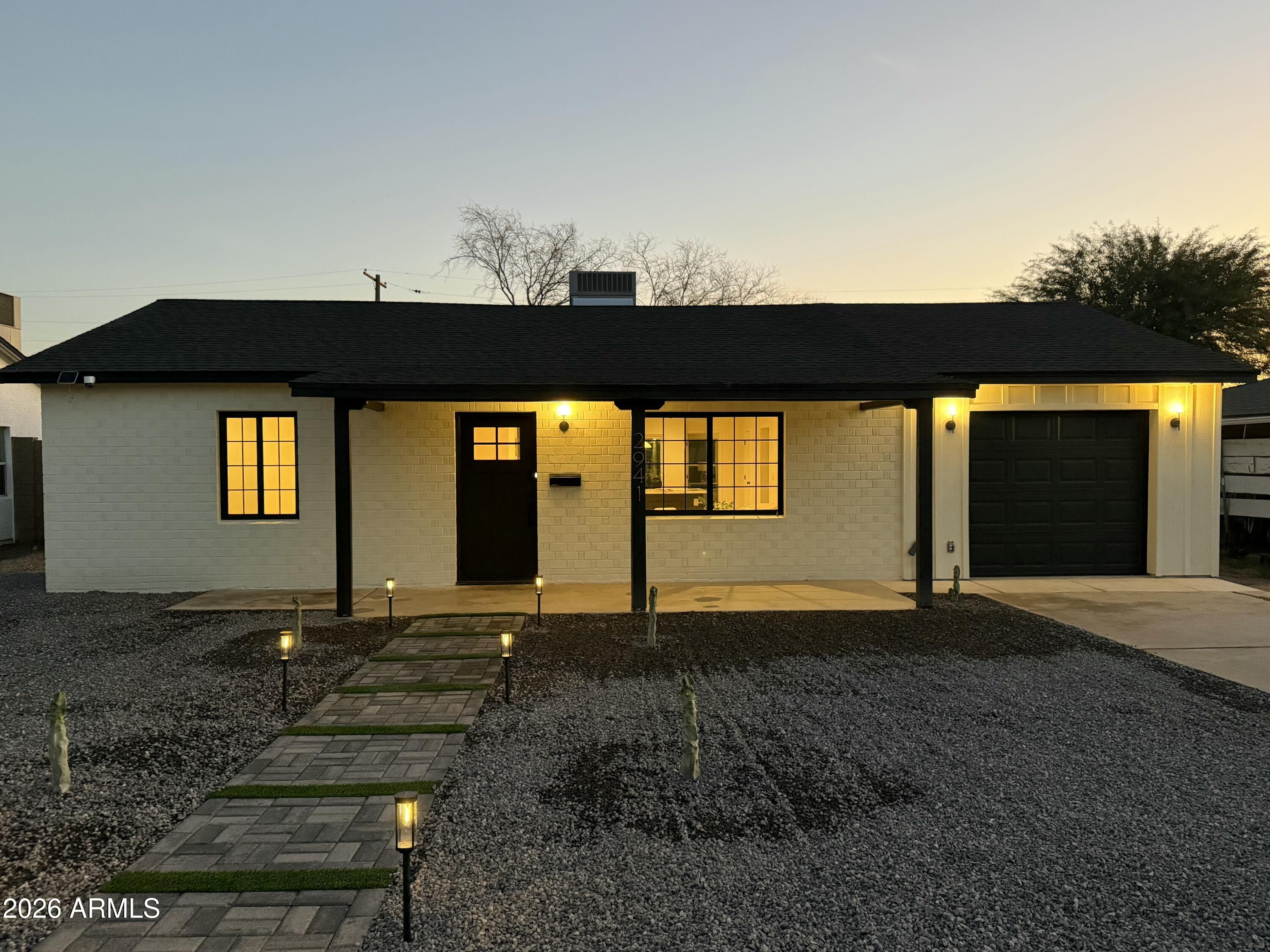 2941 East Cheery Lynn Road Phoenix, AZ 85016 - Photo 5 of 25 a front view of a house with a yard