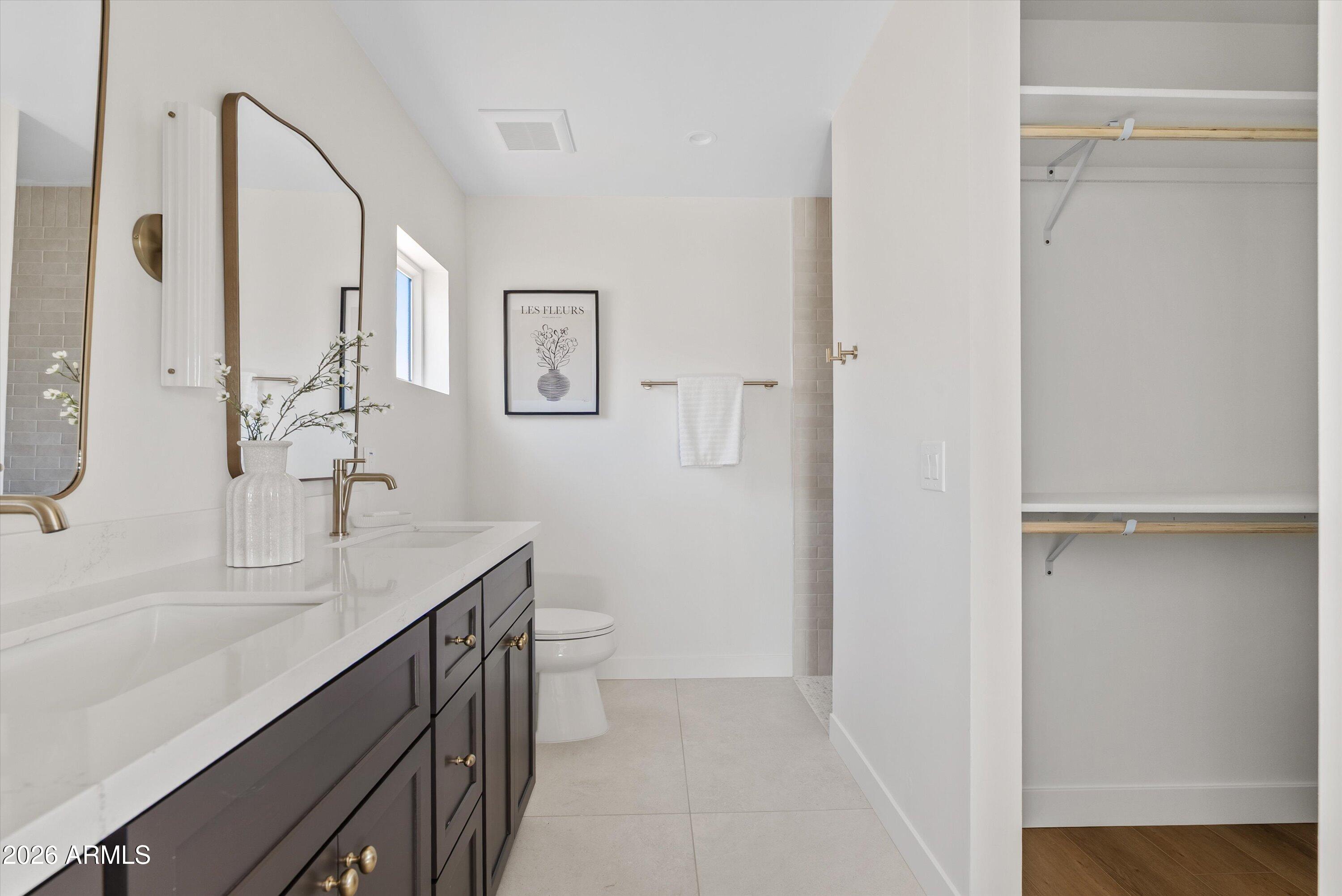 2941 East Cheery Lynn Road Phoenix, AZ 85016 - Photo 8 of 25 a bathroom with a sink and a mirror